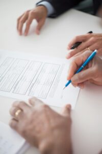 person signing a document