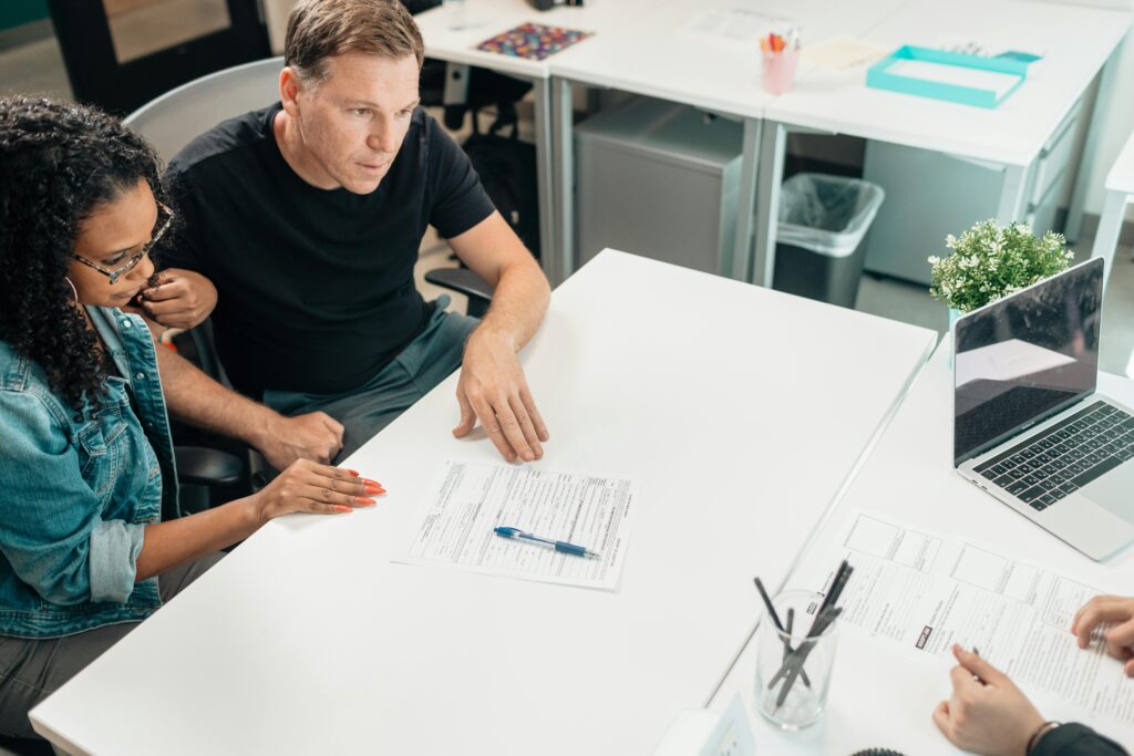 people discussing at a desk